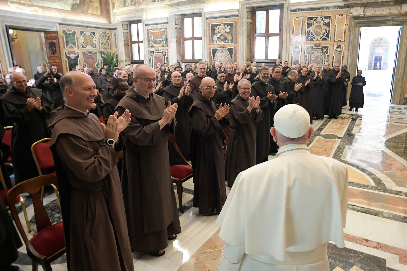 Pope Francis receives applause during an audience with participants in the general chapter of the Order of Discalced Carmelites Sept. 11, 2021, in the Clementine Hall of the Apostolic Palace at the Vatican. (CNS photo/Vatican Media)