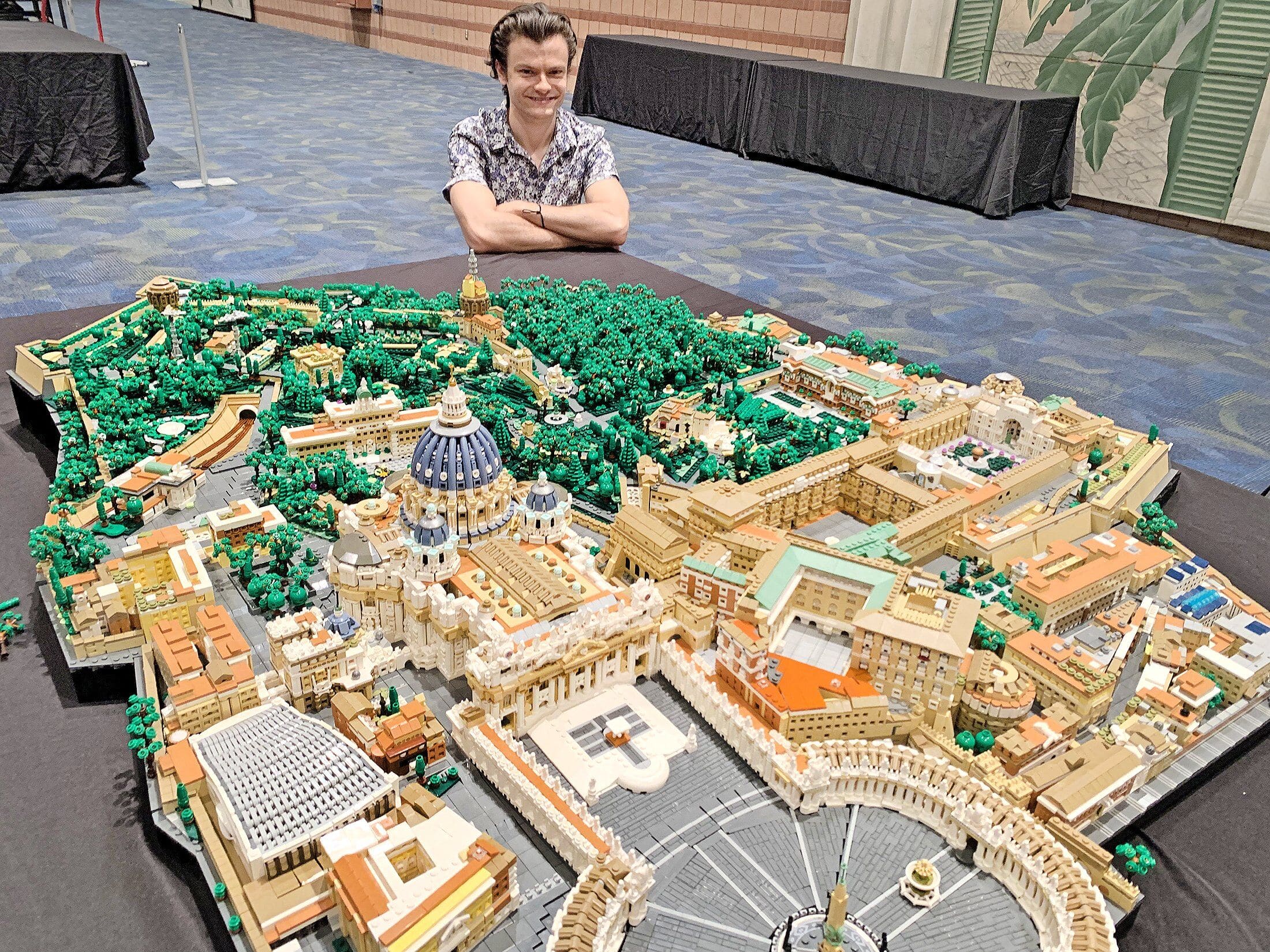 Rocco Buttliere, a LEGO architect from Chicago, is seen next to the Vatican City State replica he created that was on display Aug. 14-15, 2021, at the LEGO BrickUniverse convention at the Pontchartrain Center in Kenner, La. He spent three months in 2020 creating the scale model from 67,000 LEGOS pieces. He also completed a 114,000-piece LEGO artwork of first-century Jerusalem. (CNS photo/Peter Finney Jr., Clarion Herald)