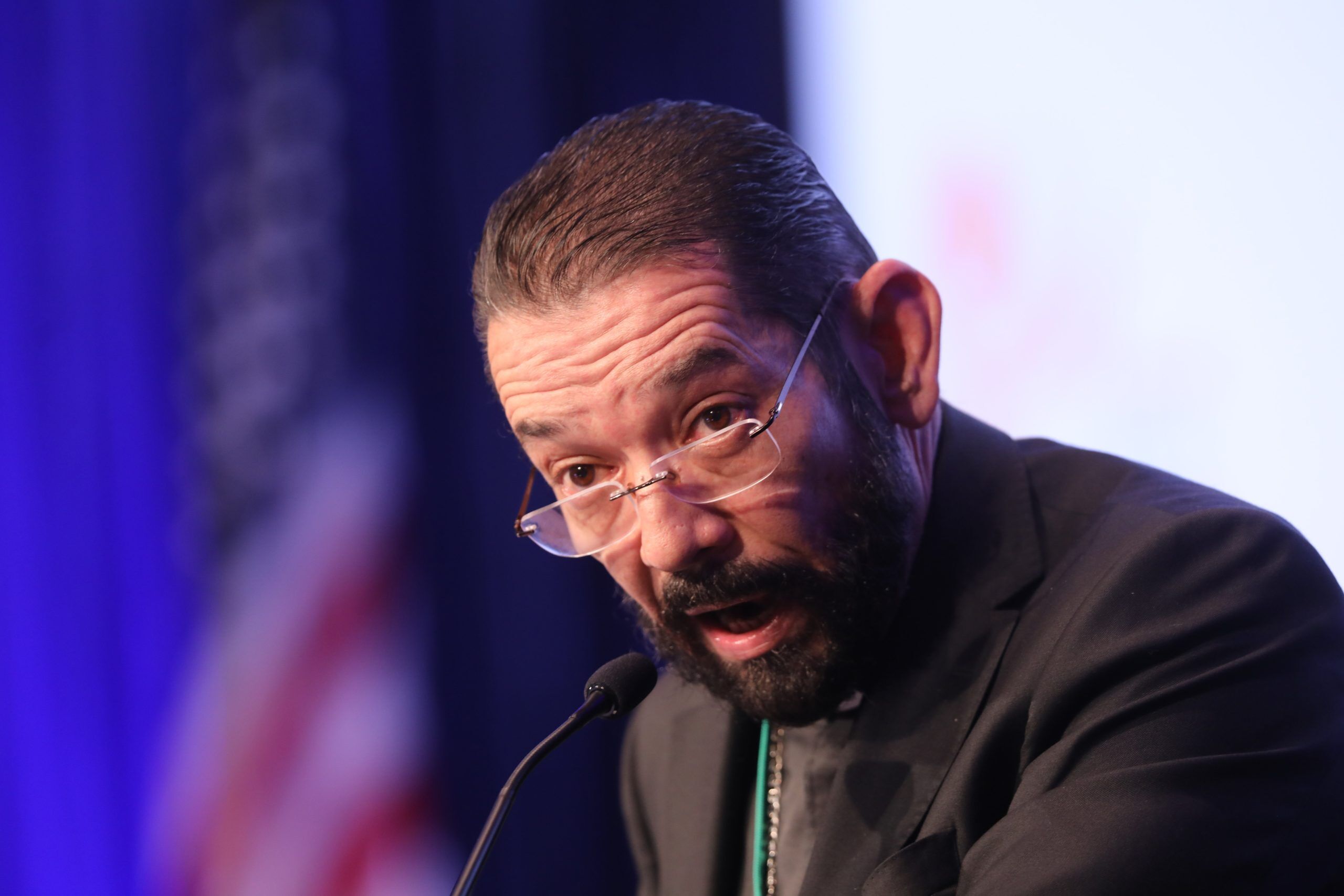 Bishop Daniel E. Flores of Brownsville, Texas, speaks during a Nov. 17, 2021, session of the fall general assembly of the U.S. Conference of Catholic Bishops in Baltimore. Due to the COVID-19 pandemic, it is the first in-person bishops' meeting since 2019. (CNS photo/Bob Roller)