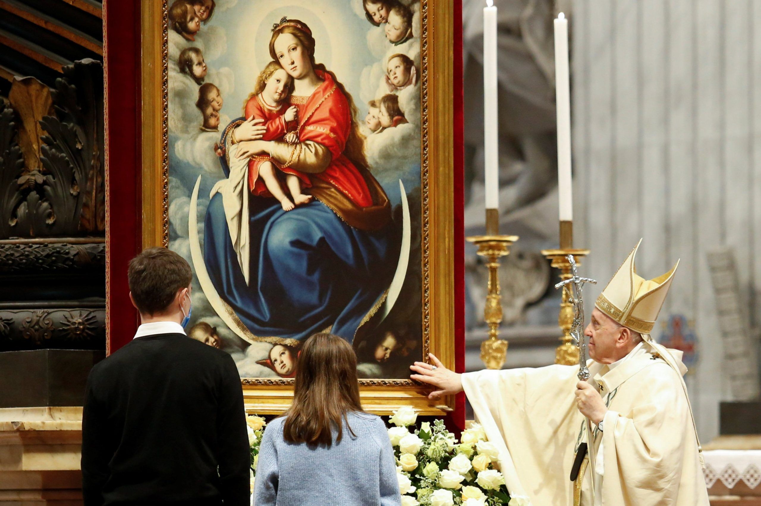 Pope Francis touches a Marian image at the conclusion of Mass for the feast of Christ the King in St. Peter's Basilica at the Vatican Nov. 21, 2021. (CNS photo/Remo Casilli, Reuters)