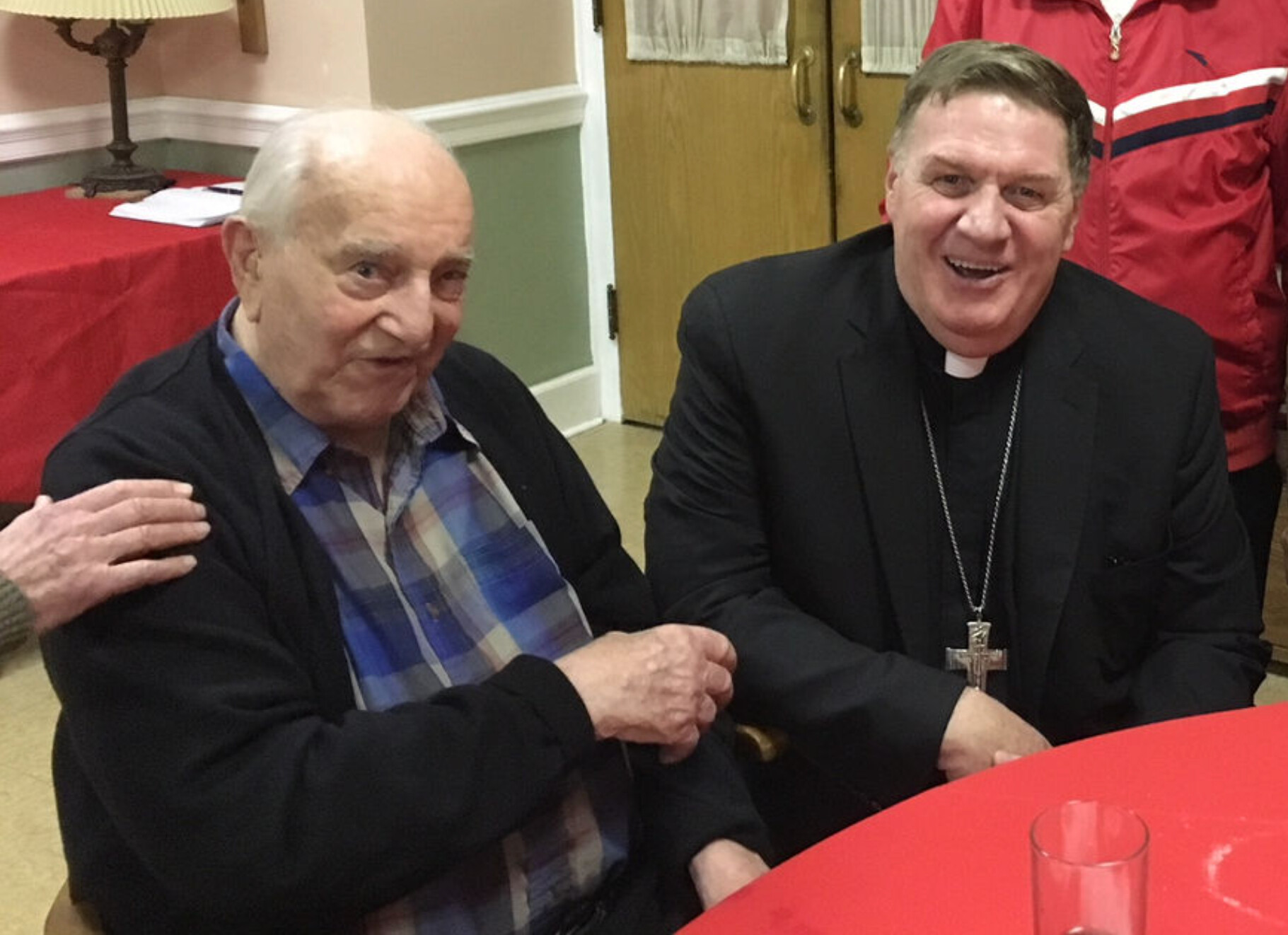 Father Joseph F. Coda, left, is pictured with Cardinal Joseph W. Tobin, C.Ss.R., in 2018.