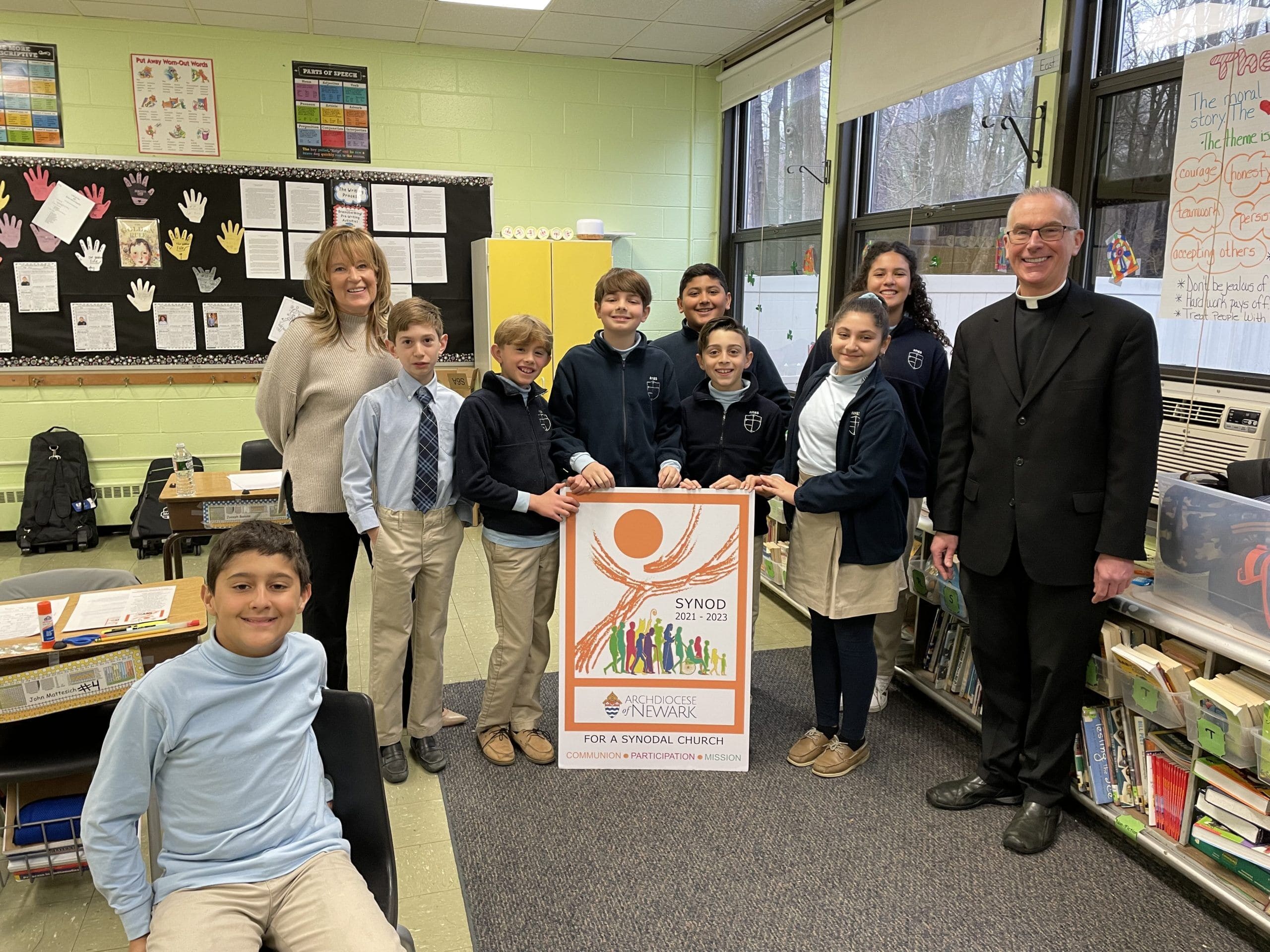 Father John Job, the pastor of Church of the Most Blessed Sacrament in Franklin Lakes, N.J., is pictured with students in Mrs. Brizzolara’s fifth grade class at The Academy of the Most Blessed Sacrament who recently participated in a synod listening session. (Photo courtesy of Father John Job)