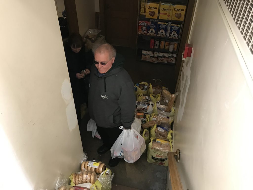 Bill and Marianne Mackey are pictured in the food pantry at Queen of Peace Church in North Arlington where the Mackeys serve and worship. (Photo by Jai Agnish/Archdiocese of Newark)
