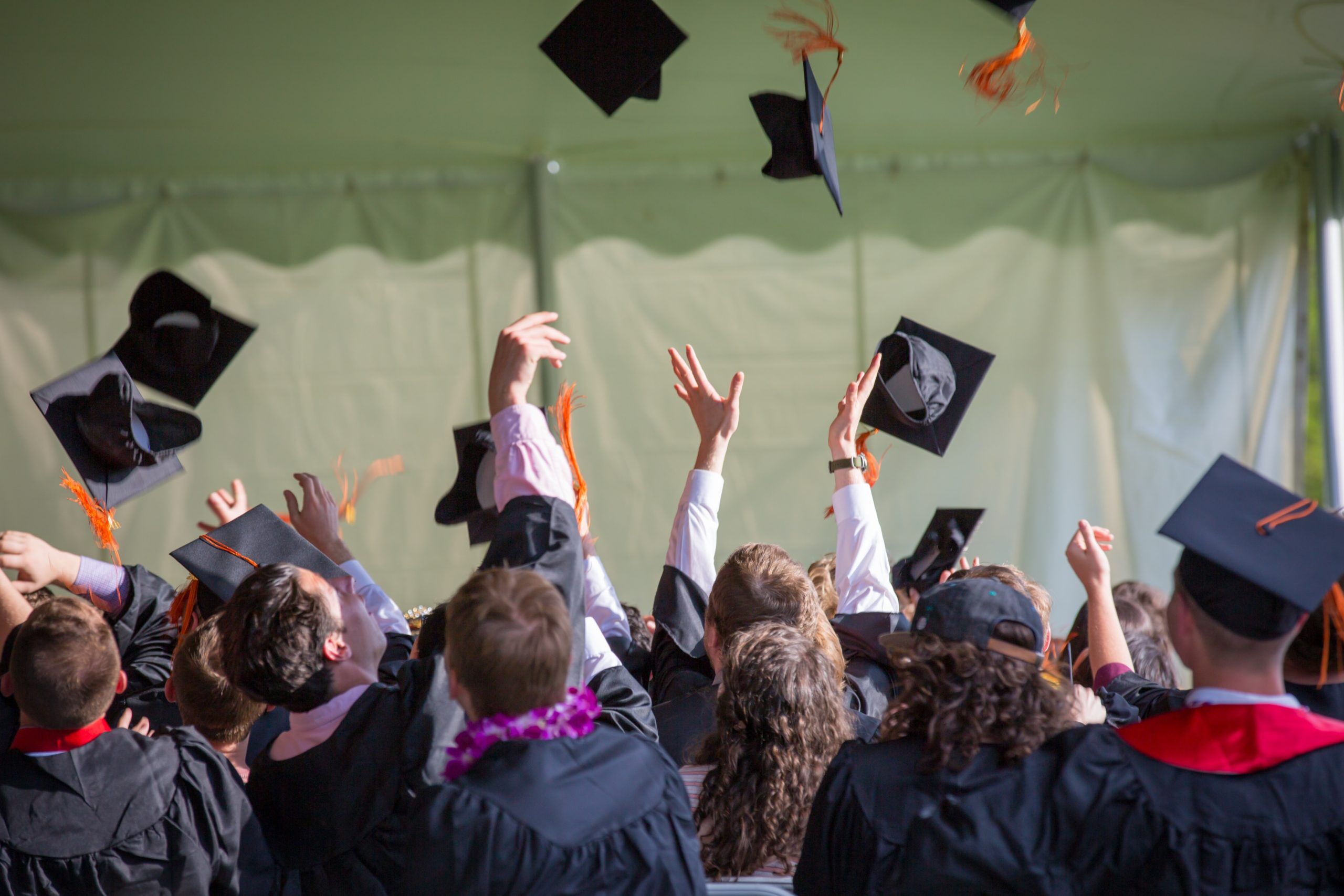 Throwing graduation caps by Emily Ranquist from Pexels