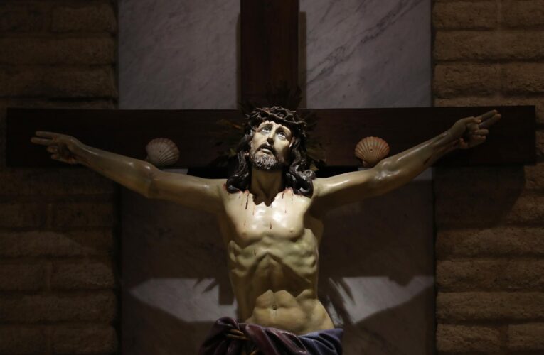 Reaching out in faith: Should Jesus be depicted on crucifixes as alive or dead?
