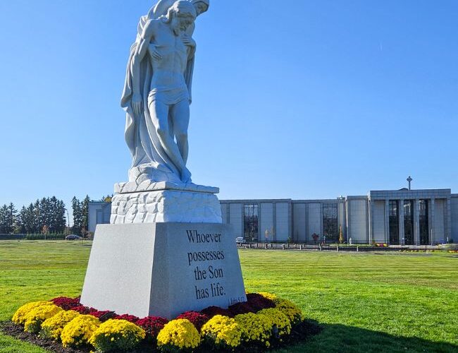 Sacred art meets modern memorial: Historic pietà graces cemetery entrance