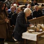 Audience members place the names of potential deportees on a table (OSV News Gregory A. Shemitz photo).
