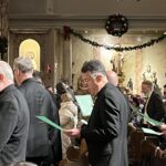 Bishop James F. Checchio joins in prayer.