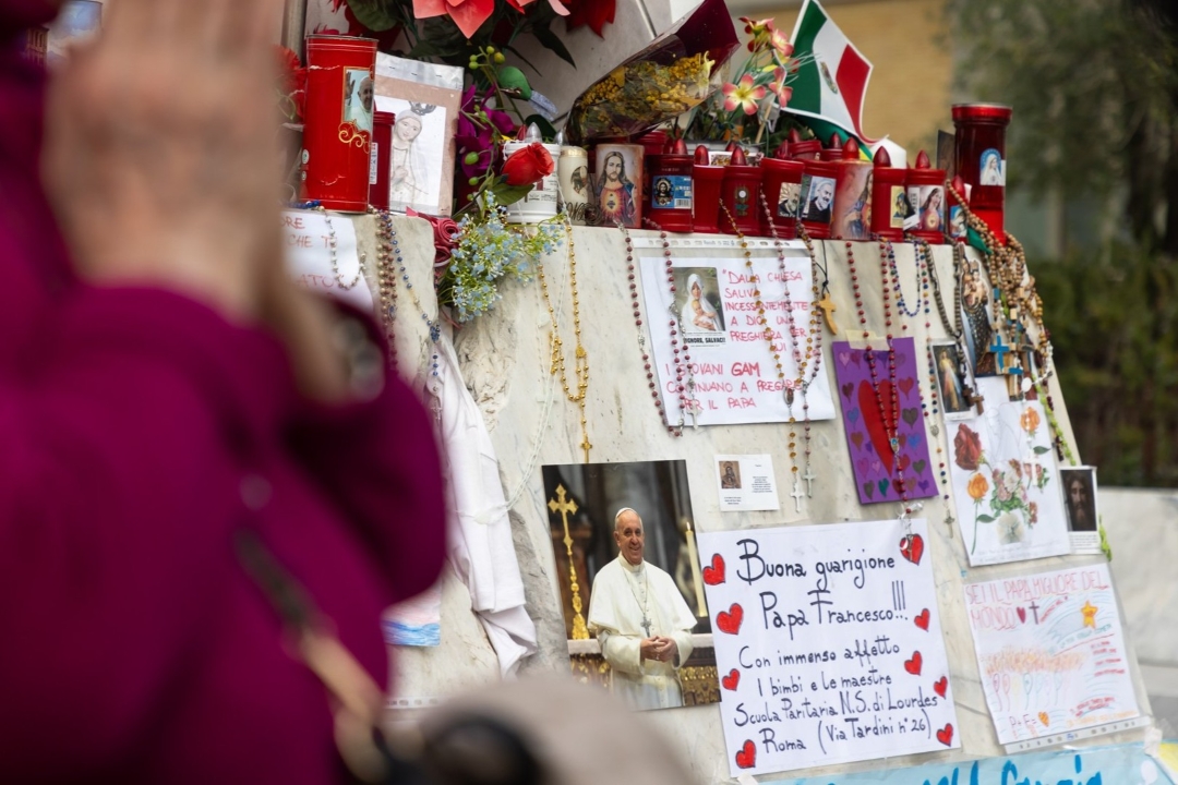 Woman prays for Pope Francis outside Rome's Gemelli Hospital on March 8, 2025