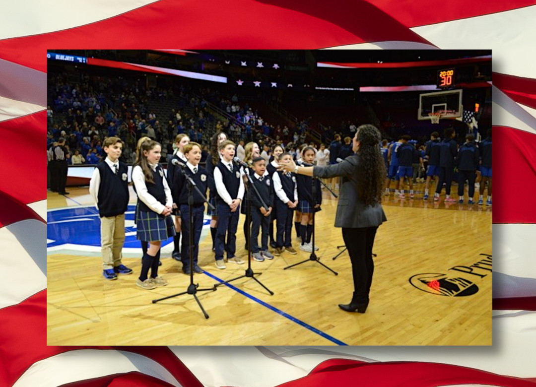 Academy of Our Lady students sing the National Anthem at the Prudential Center on Tuesday, March 4, 2025