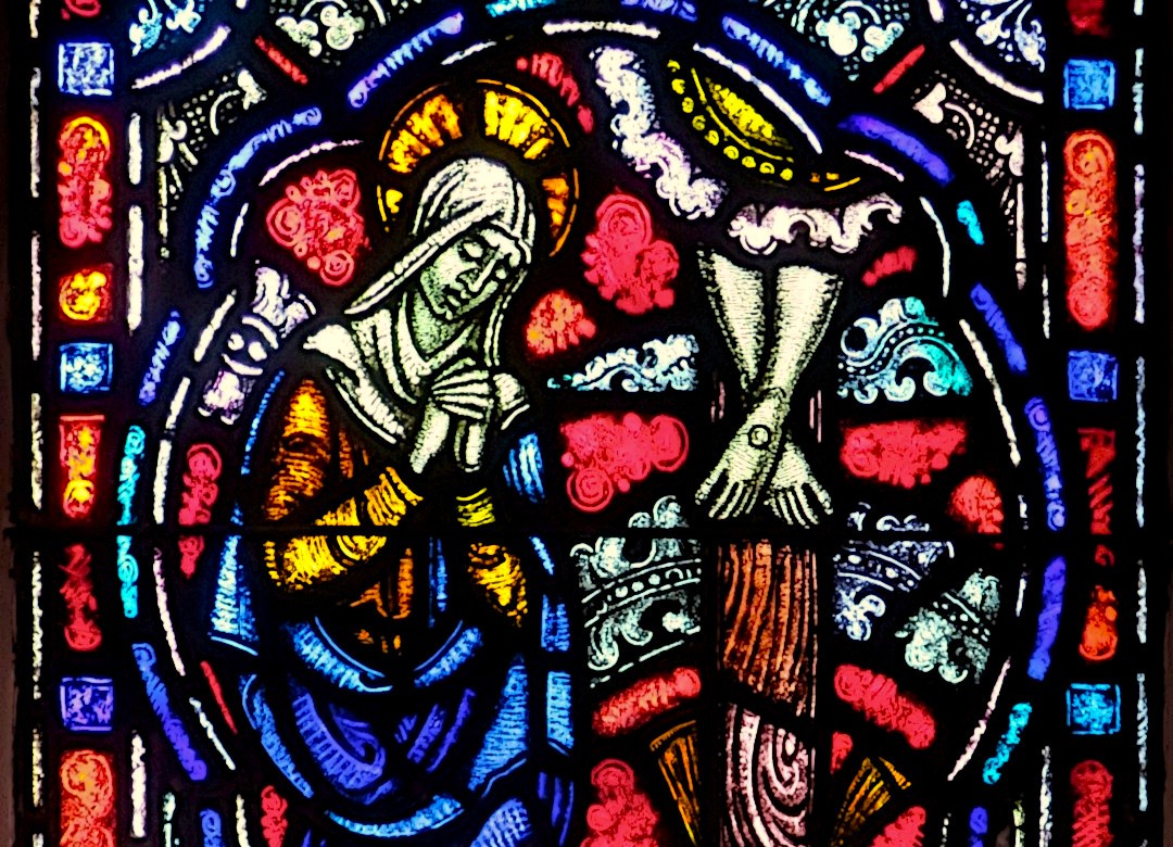 Mary at the foot of the cross stained-glass window