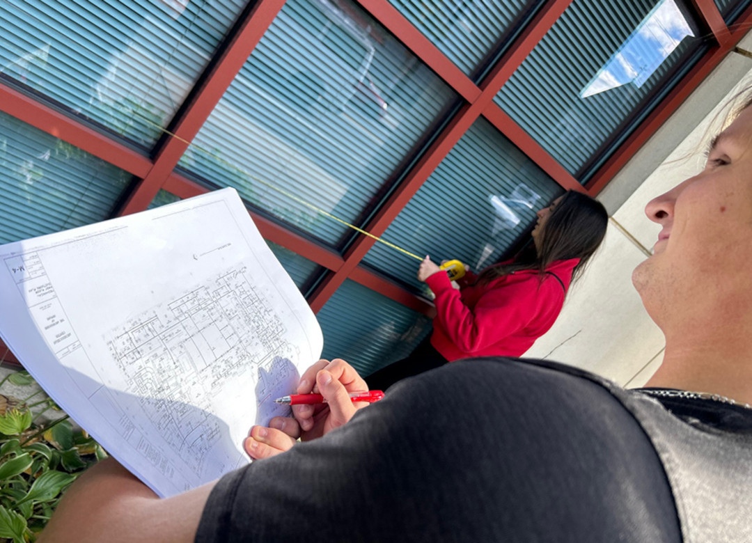 Catholic University of America students take measurements of the pastoral center for the Newark Archdiocese as part of a pilot course providing energy and sustainability recommendations to Catholic dioceses. (Patricia Andrasik)