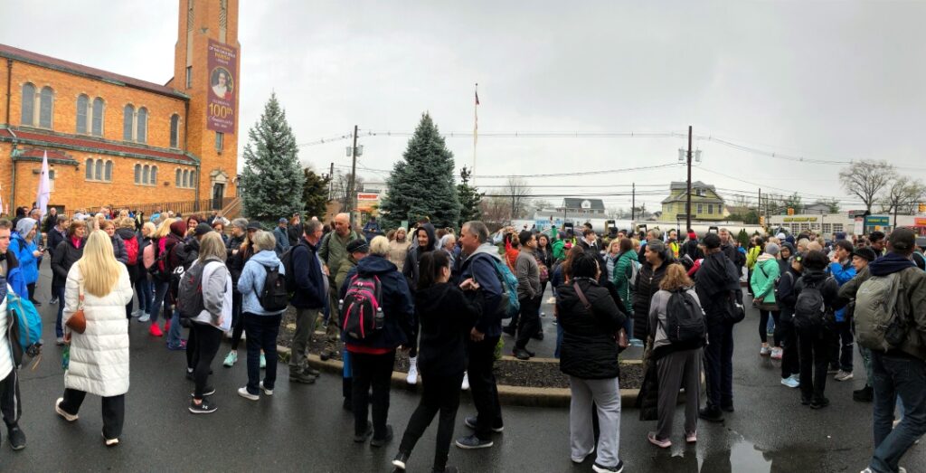 The crowd gathers at St. Theresa of the Child Jesus Parish in Linden as the "10 Miles with Jesus" event prepares to begin the pilgrimage