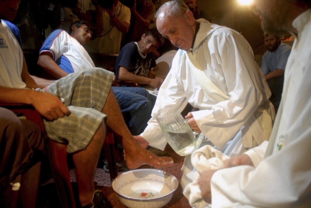 Argentine Cardinal Jorge Mario Bergoglio washes the feet of residents of a shelter for drug users during Holy Thursday Mass in 2008 at a church in a poor neighborhood of Buenos Aires, Argentina. (OSV News photo/Enrique Garcia Medina, Reuters)