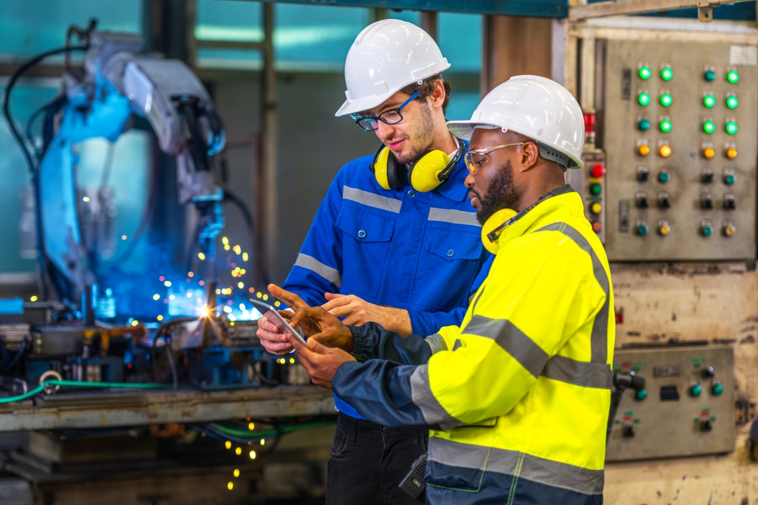 Two men working at factory