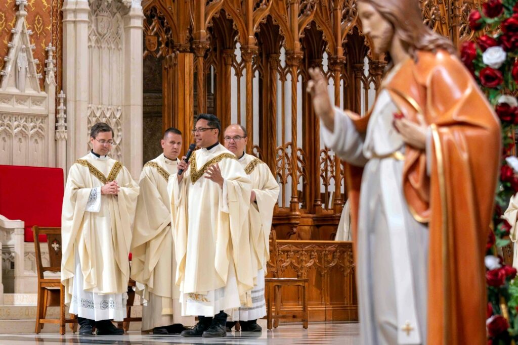 Father Chau addresses the basilica congregation on the Feast of the Sacred Heart
