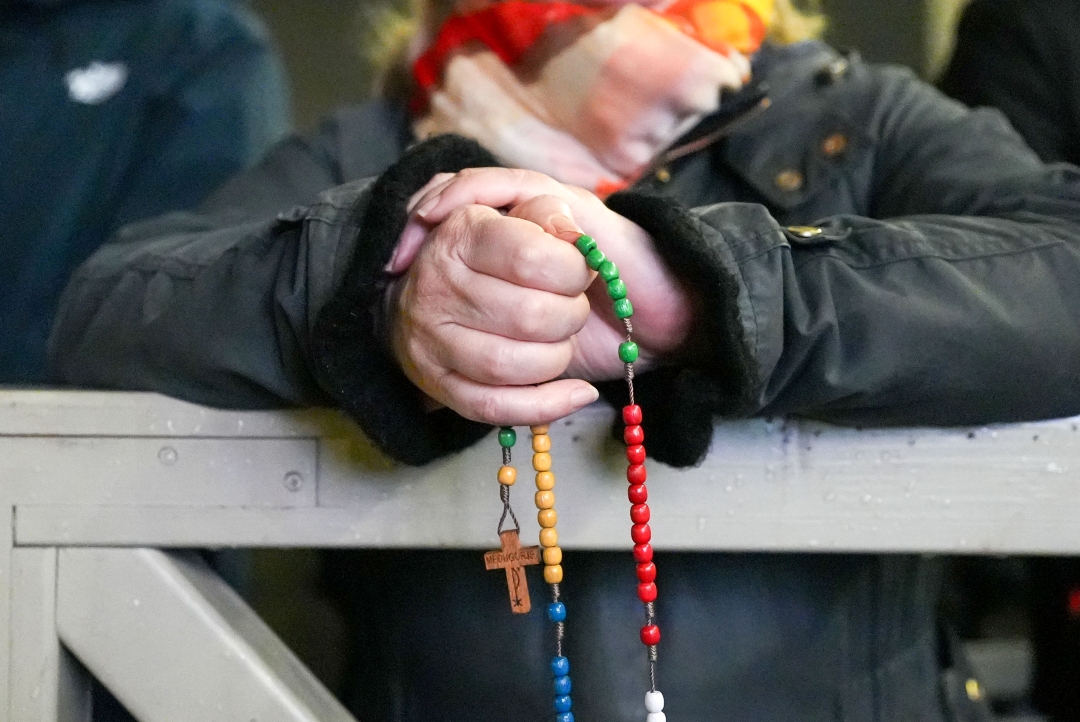 Praying rosary St Peters Square