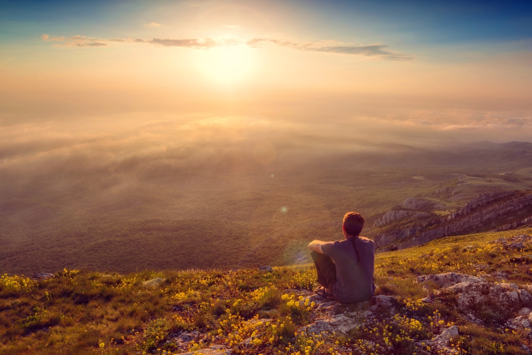 contemplaing sunset in mountains
