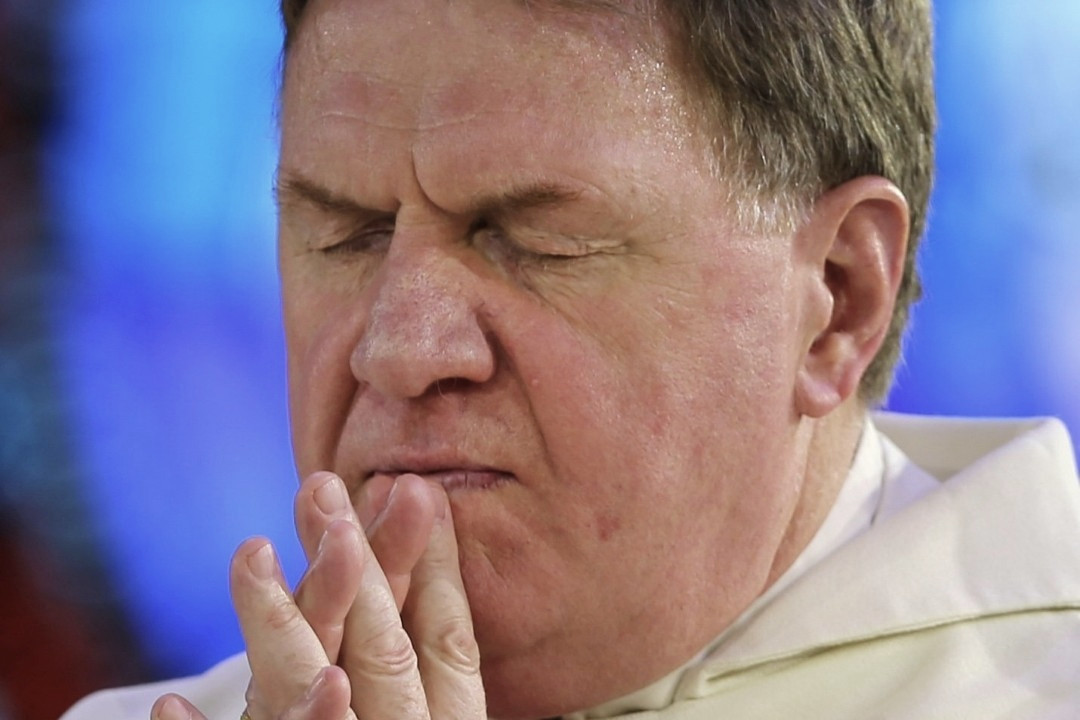 Cardinal Tobin praying