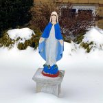 Marian statue at Saint James Parish in Springfield after snowstorm