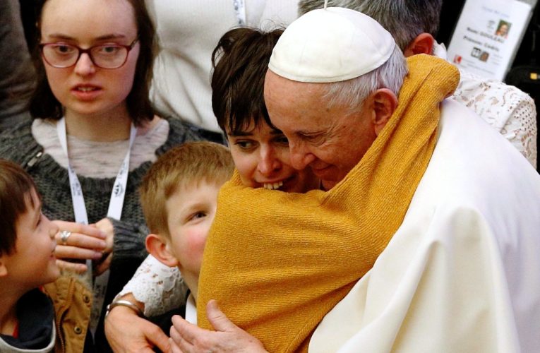 Pope Francis embraces young woman in Feb 2022 general audience