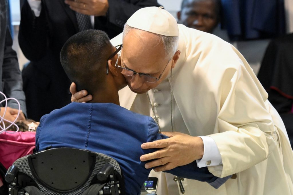 Pope Leo XIV embraces a person as he visits the Pontifical Shrine of the Blessed Virgin of the Rosary of Pompeii near Naples, Italy, before celebrating Mass in the piazza outside May 8, 2026, on the first anniversary of his election as the first American pontiff. He visited 400 sick and disabled people inside the shrine. (OSV News photo/Mario Tomassetti, Vatican Media)