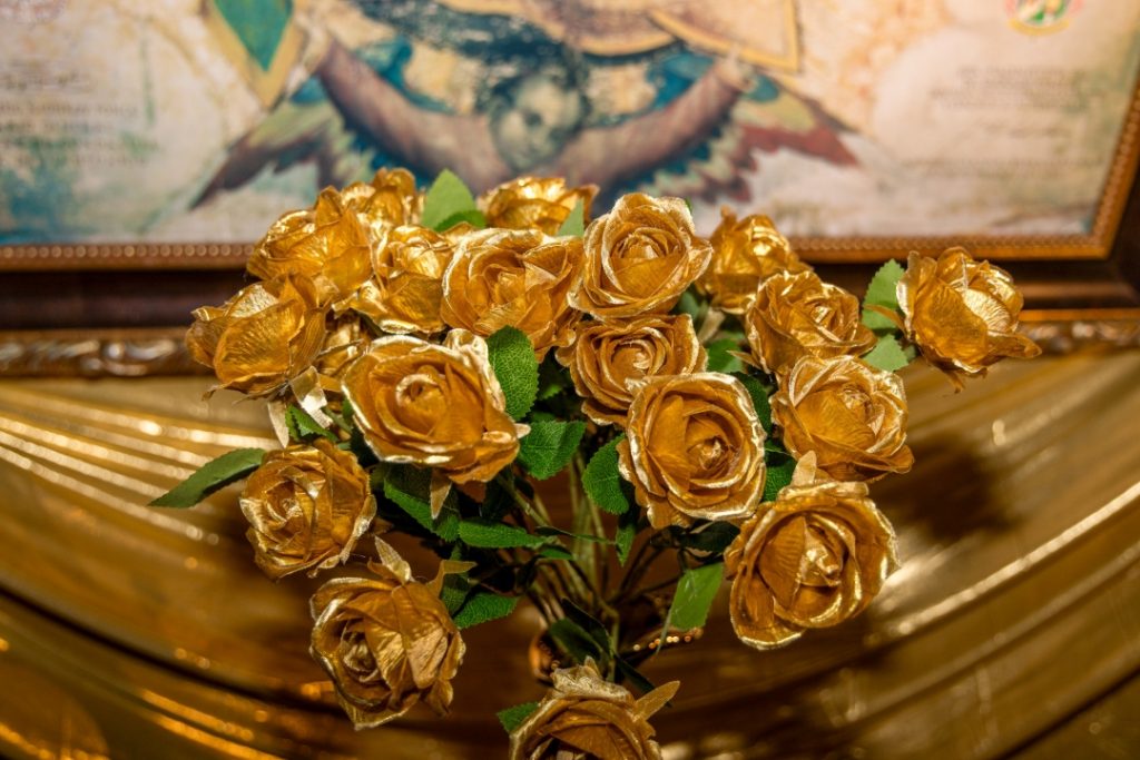 Gold roses at shrine of Our Lady Guadalupe
