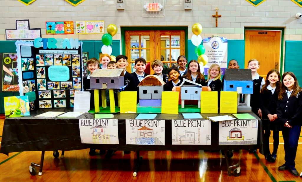 st cassian students pose with STEAM projects