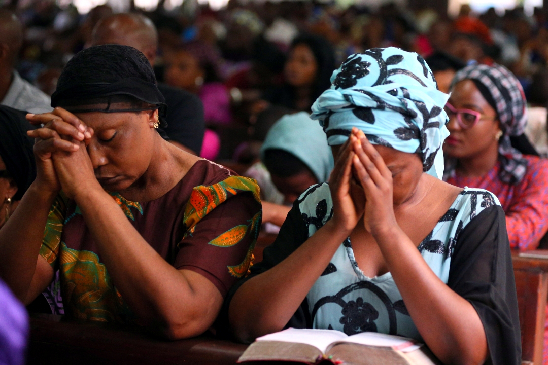 Women praying in Nigeria