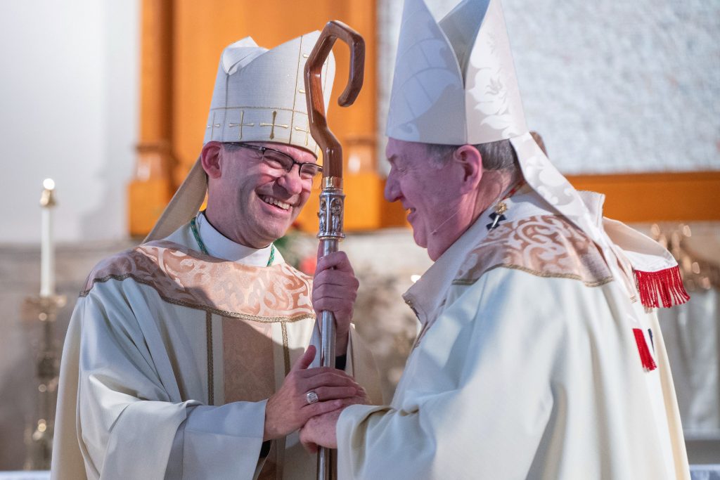 Cardinal Tobin presents crozier to Bishop Saporito